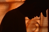 Silhouette of a tired worker. Do we work too much?